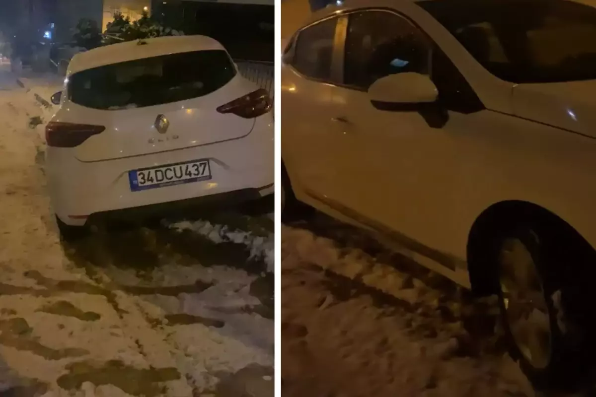 Oliver Ntcham kar yağışında aracını kontrol etmeye çalışıyor