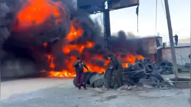 Yanmış lastik yığını ve dumanlar