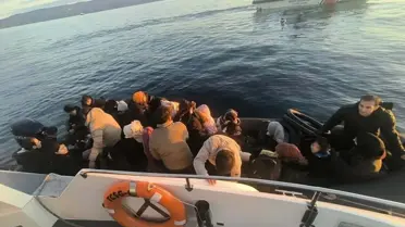 Gözaltına alınan kaçak göçmenler ve organizatör