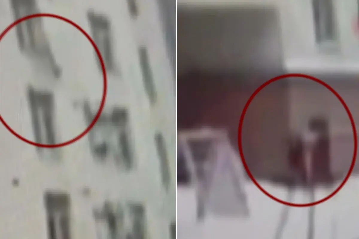 St. Petersburg’da düşen çocuk ve onu yakalayan apartman görevlisi