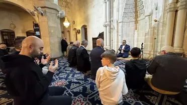 Mevlit programına katılan asker ve aileleri